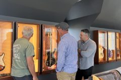 admiring-autographed-guitars